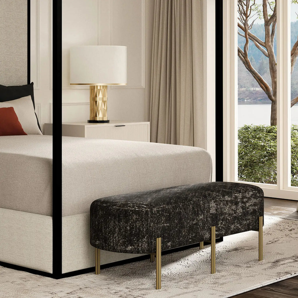 Alexa Bench shown in Opaque Gold Finish with Verona Ash Fabric in a modern bright cream and black bedroom.