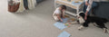 Family living room with child drawing on Astro berber textured carpet in Russet (4630), durable pet-friendly flooring by DreamWeaver