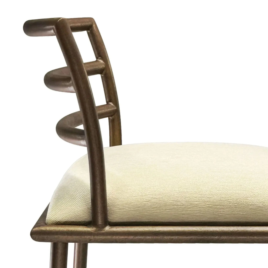 A close-up view of the Harmony Barstool in Copper Bisque finish with Chalk fabric.