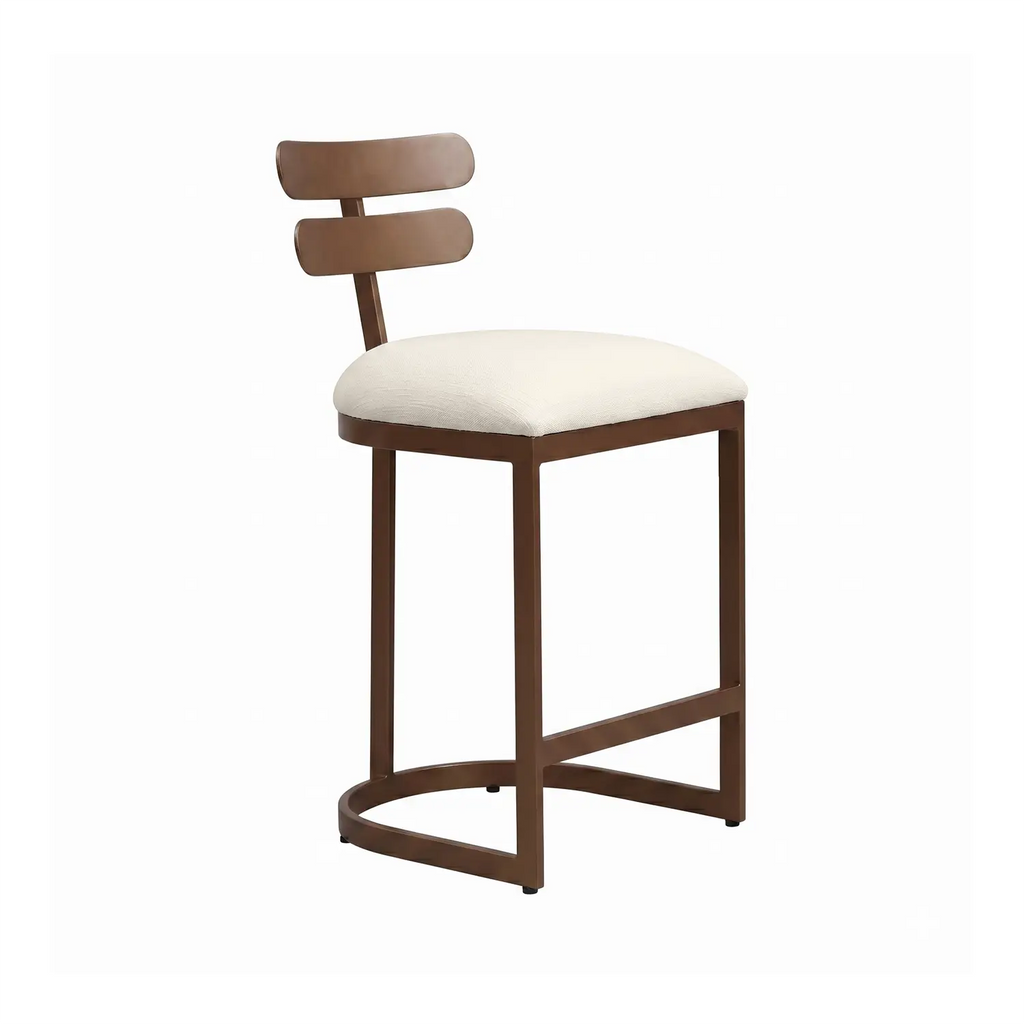 Orion iron barstool shown in Opaque Copper Finsih with Chalk Performance Fabric. Shown in angle view of the barstool.