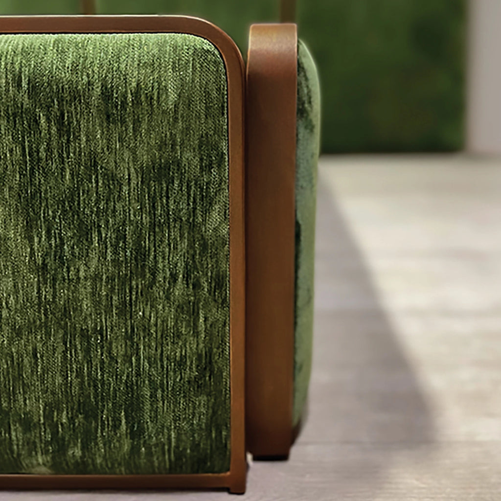 Close-up of the River Bed Footboard in Hand Brushed Copper Bliss Finish with Forest Green Fabric.