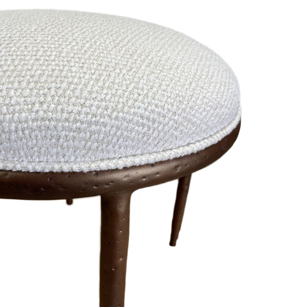 Royce Ottoman Close-up Image. Shown in Hand Hammered Copper finish with French Ivory Performance fabric.